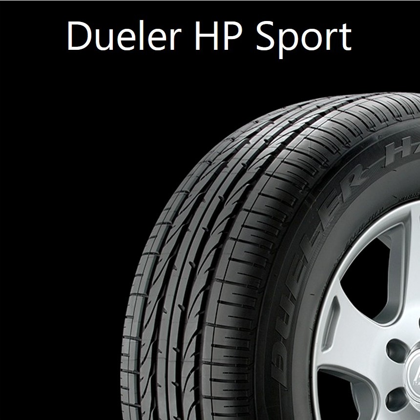 A close up of a Bridgestone Dueler HP Sport tire